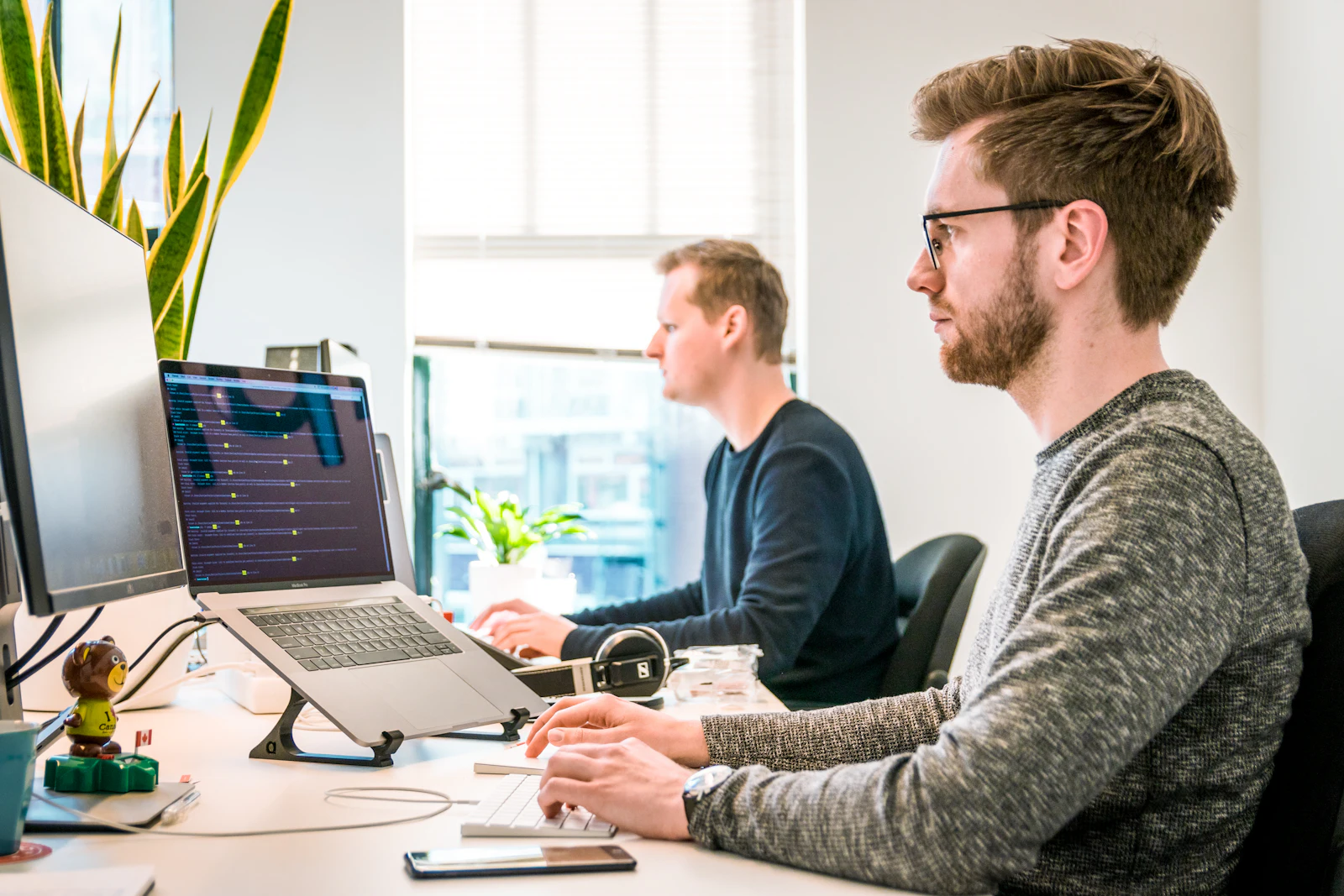 Developers working at their monitors.